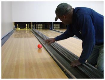 A worker sends a ball down one of eight candlepin lanes in the new Belfast branch of Waldoboro-based All Play Family Entertainment Center. (Photo by Ethan Andrews)