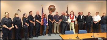 Chief Jordan with members of the City Council and members of Rockland's fire and EMS service.