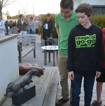 Up on the roof of Harbor Square Gallery, teens analyze a horse sculpture. (Photo by Lynda Clancy