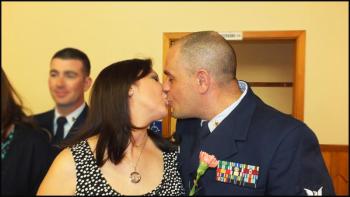Brenda and Joaquin Guzman share a kiss during the spouse appreciation portion of the dinner.