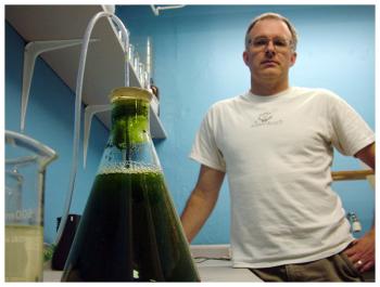 John Tipping of Lotic, Inc. with an Erlenmeyer flask of algae to feed to water fleas for environmental toxicity tests. (Photo by Ethan Andrews)