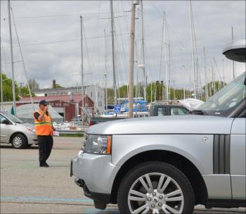 Parking attendants move vehicles into lines at the Rockland Ferry Terminal. (Photo by Lynda Clancy)