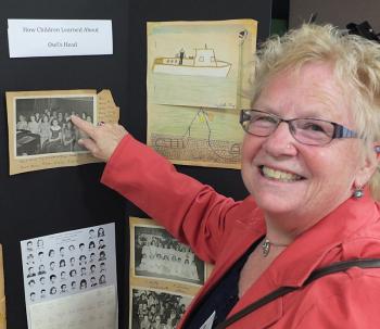 Nancy Palmer-Van Dyke points to a picture of herself as a school girl. (Photo by Chris Wolf)