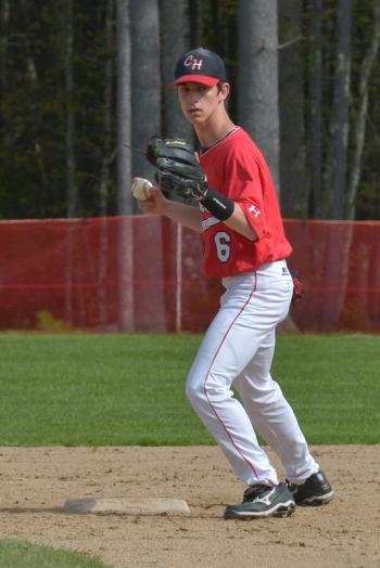 Camden Hills’ Ben Rollins looks the runner back to first after a base hit in the first inning. (Photo by Ron Hawkes)