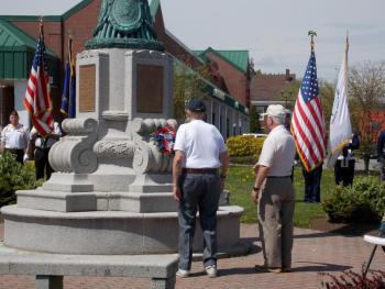 Robert Henry and Roger Vroomlay lay a memorial wreath. (Photo by Alyssa McCluskey)