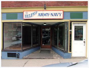 Belfast Army Navy closed at the end of April. Signs in the window suggest the storefront will be used next for a Christmas and gifts shop. (Photo by Ethan Andrews)