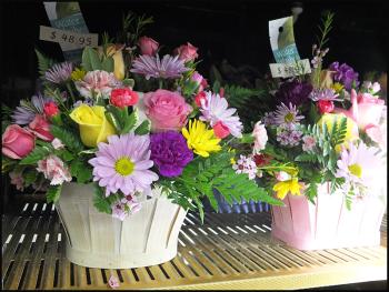 Flowers in the case at Hoboken Gardens waiting for a special mom to get them.