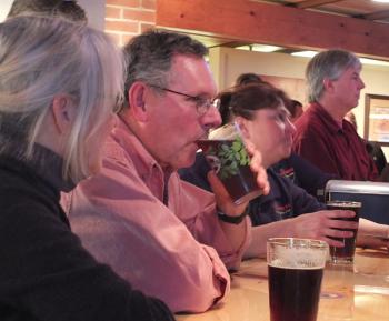 Tom Crowley sips a beer.