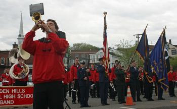 During the 9 a.m. Memorial Day service at the Camden Public Landing, Chandler Crans plays taps, while Aaron Nolan (not shown) plays in echo in the background. (Photo by Holly S. Edwards)