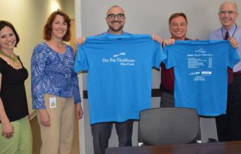 Rachel McCormick, Pen Bay Healthcare executive assistant; Bonnie Augustine, development information specialist; Erik Frederick, chief operating officer; Robert Augustine, desktop support specialist; and Tom Girard, vice president of human resources, will be participating in the 2014 Run For Your Life Emergency Service Challenge May 24 at the Camden Snow Bowl. (Photo by Lynda Clancy)