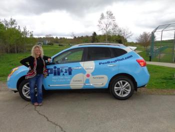 Look for The Pilot’s own Holly Edwards and her unforgettable car in the film at the dog park. (Courtesy Mary Jean Crowe)