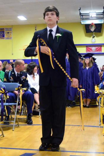 The 2014 Class Marshall Adam Elwood Smeltzer led the students to their seats for graduation. (Photo by Ron Hawkes)