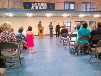 Corrections Corporal Robert Bowen and Kane at graduation. (Photo courtesy Maine Dept of Corrections)