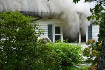 Smoke overtook the structure as the inside of the building completely burned. (Photo by Lynda Clancy)