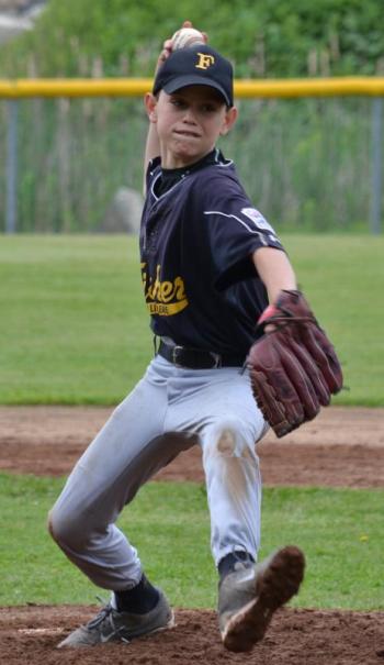 Fisher’s Jude Forti prepares to pitch the ball. (Photo by George Harvey)