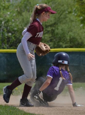 Autumn Oxton (1) slides safely into second base. (Photo by George Harvey)
