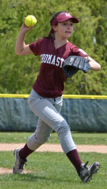A McMahon Builders player prepares to throw the ball to first base. (Photo by George Harvey)
