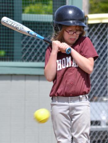 A McMahon Builders player reacts as the ball comes too close for comfort. (Photo by George Harvey)