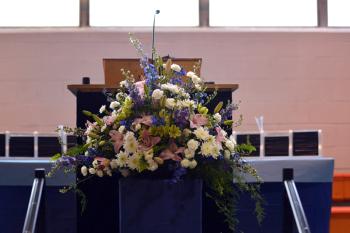 This bountiful bouquet was tipped over numerous times during the course of the evening, providing some comic relief. (Photo by Ron Hawkes)