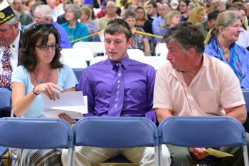 Missy Dean, left, gets ready to present to recipients of the Dustin Osier Memorial Scholarship along with brother Shane Osier, center, and Dustin’s dad, John. Dean presented four $500 and one $1,000 scholarships to graduating seniors and six $500 scholarship awards to post graduates. (Photo by Ron Hawkes)