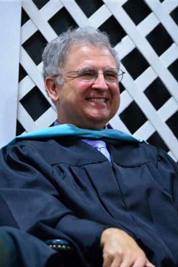 Principal Harold E. Wilson was all smiles most of the evening. (Photo by Ron Hawkes)