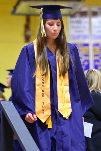 Senior Taylor Kathleen Mason leaves the stage after receiving another scholarship award. (Photo by Ron Hawkes)