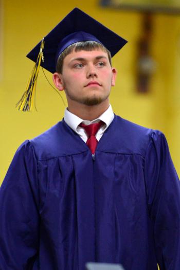 Brandon Leigh Sykes walks off stage with his diploma. (Photo by Ron Hawkes)