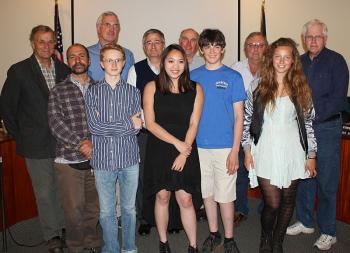 Watershed School Science and Engineering teacher Peter Kalajian and student Jerin Brooks, Heather Dumond, Jesse Dunn and Louisa Crane, pose with Ross Parker and the Camden Select Board Tuesday night. (Photo by Holly S. Edwards)