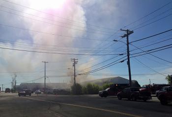 A fire that started in the basement of Redlon & Johnson on Tillson Avenue in Rockland sent plumes of black smoke into the air Sunday morning, June 22. (Photo by Lynda Clancy)