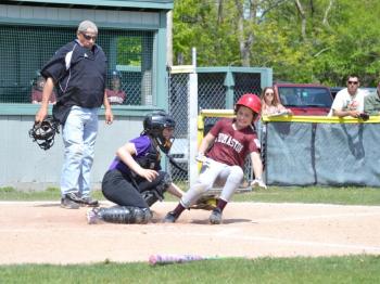 The Islanders catcher tags out a McMahon Builders runner at the plate. (Photo by George Harvey)