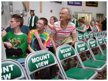 Family members stretch to get a look as the Mount View High School Class of 2014 enters the school gymnasium for Saturday’s commencement ceremony. (Photo by Ethan Andrews)