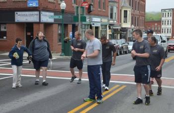 Camden police and Graham Wiley get ready to hit the pavement in downtown Camden just after 8 a.m. June 5 on the annual Torch Run. (Photo by Lynda Clancy)