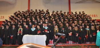 Standing proudly with their diplomas, the Camden Hills Regional High School Class of 2014, which graduated June 6. The class motto: “I can’t change the direction of the wind, but I can adjust my sails to always reach my destination.” — Jimmy Dean. (Photo by Lynda Clancy)