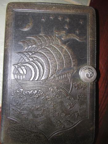 The old leather journal where Pirate John writes most of his poetry and observations. (Photo by Kay Stephens)
