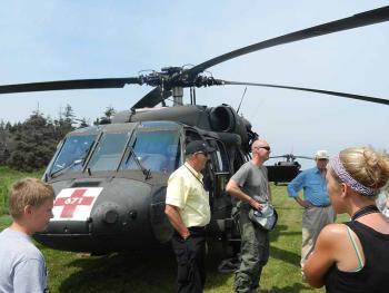 Don Grinnell, of the Knox County Emergency Management Agency, and Major Nathan Arnold, of the Maine Army National Guard 126th Aviation Unit, describe the exercise on Criehaven. (Photo by Eva Murray)