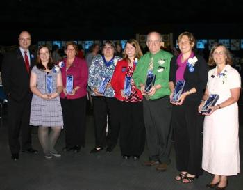 Greg Dufour, president and chief executive officer of Camden National Bank, congratulates award winners at this year’s Stakeholder Appreciation Event held on June 18 at the Augusta Civic Center. Pictured left to right: Dufour, Penny Johnson, Tena Wallace, Cindy Dines, Angie Snow, Danny Jackson, Betsy Maguire and Susan Van Allen.