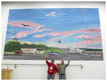 Hurley, right, and Russell Kahn in front of the finished mural. (Photo courtesy of David Hurley)
