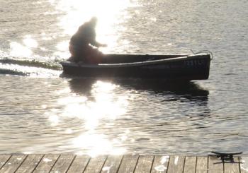 Skiffs ply the harbors until the ice skims the water. (Photo by Lynda Clancy)