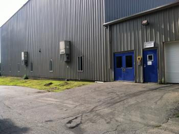 The side entrance to the former Coastal Farms and Foods facility showed subtle signs of life as the blueberry processing side of the facility this week under new ownership. (Photo by Ethan Andrews)