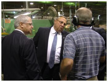 Gov. Paul LePage talks with Pride Sports executives inside the company’s Burnham manufacturing plant, Sept. 17. (Photo by Ethan Andrews)