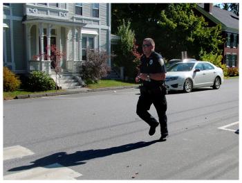 Belfast Police Officer Rick Smith ran the 5K in full uniform, including boots, a bulletproof vest, and guns to show support for WeCARE. (Photo by Ethan Andrews)