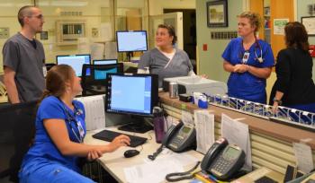 Staff at Pen Bay Medical Center in Rockport keep an eye on monitors in the emergency department’s operations hub. Pen Bay’s ED staff comprises 12 doctors, 20 nurses and eight technicians. Here, Eric Davis, Katie Holmes, Kayla Gushee, Stephanie and Aimee Lash-Radic get ready for the changing of the guard. (Photo by Lynda Clancy)
