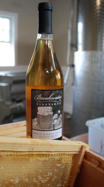 Breakwater Vineyard Bee’s Knees Mead and a frame of honey-extracted honeycomb. (Photo by Holly S. Edwards)