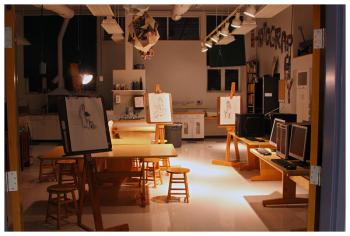 Drawings displayed on easels in an art classroom. (Photo by Charles R. Hamm)
