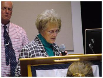 Kathy Littlefield, selectwoman from the town of Waldo, asks the panel of state candidates about funding for roads. (Photo by Ethan Andrews)