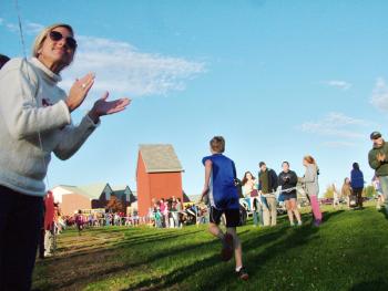 Supporters cheer on runners at the Busline League middle school cross-country championships in Belfast, Oct. 20. (Photo by Ethan Andrews)