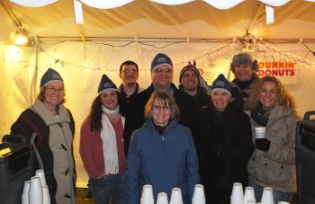 Camden National Bank volunteers: Joanne Campbell, Mary Crabtree, Matthew Burns, Connie Sawyer, Randy Cruz, Mike Archer, Jayne Cushman, Mrs. Santa Claus (Nancy Jaffers) and Sarah Baran.