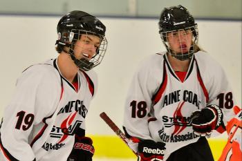 The Storm’s Thomas Griebel, left, is all smiles after giving the Storm a 2-1 lead. Roy, right, had her second assist of the game on the goal. (Photo by Ron Hawkes)