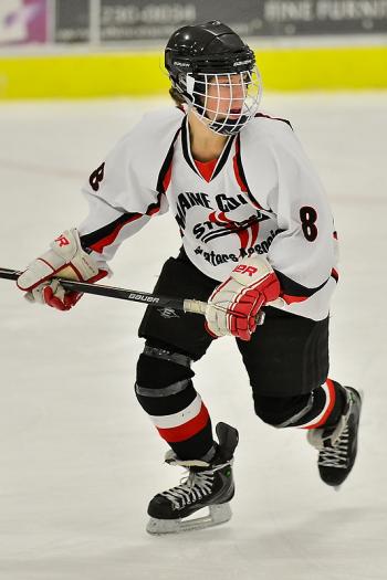 The Storm’s Cameron Christie looks to receive the pass as he skates up the ice. Christie scored the first goal for the Storm. (Photo by Ron Hawkes)
