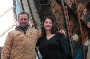 Noah and Jane Barnes, owners and operators of the schooner ‘Stephen Taber,’ now also own the schooner ‘Nathaniel Bowditch’ and are rebuilding it inside a wood-heated temporary building at Lyman Morse Boatbuilders on the Thomaston waterfront. (Photo by Holly S. Edwards)